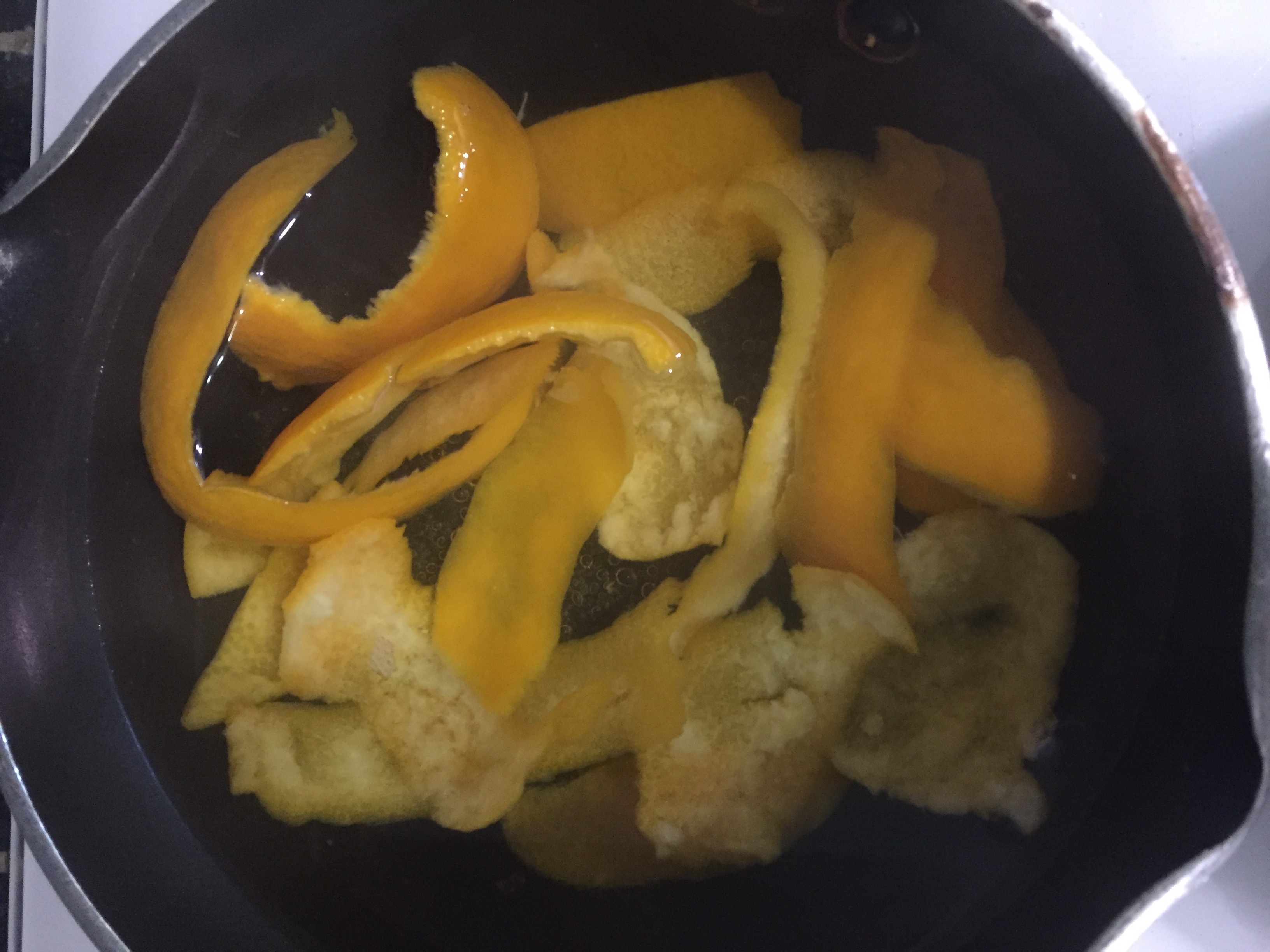 Orange rinds in boiling water
