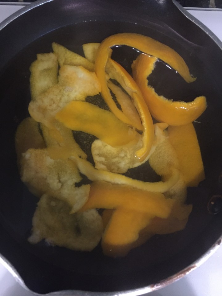 Orange rinds in boiling water